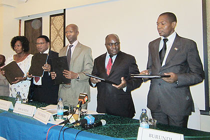 Ministers from Burundi, Uganda, Rwanda, Tanzania and Kenya stand in unity after ratifying the protocol on Saturday in Dar-es-Salaam. The New Times/  Jean P. Bucyensenge.