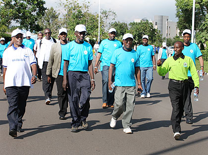 CJ Rugege (C) with other officials during the march. The New Times/ Courtesy