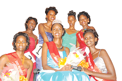 Miss SFB Grace Elsie Ingabire (C) is joined by the first runner-up Faith Gasatura (R), the second runner-up Laurne Manzi (L)and other contestants.