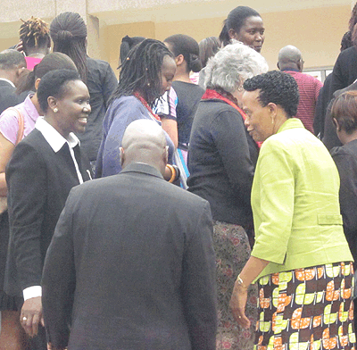 Munyaneza (R) interacts with womenu2019s activists who gathered in Kigali yesterday. The New Times/ Eugine Kwibuka.