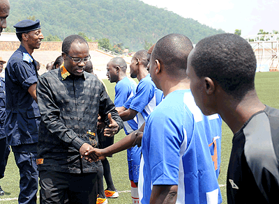 Mayor Ndayisaba and Assistant Commissioner of Police Christopher Bizimungu shake hands as the former inspects the Police team that played a friendly against motorists  at the weekend. ....