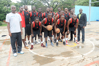 Jean Bahufite (left) has made history by becoming the first coach to lead Espoir to the league title for the first time in eight years with an unbeaten record. The New Times /  J. Mbanda.