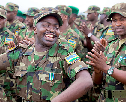 RDF soldiers sing after returning from South Sudan yesterday. The New Times/ Timothy Kisambira. 