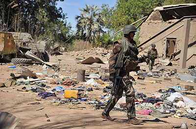 French soldiers walk around an area destroyed during aerial bombings as they arrive in the city of Diabaly, on January 21, 2013: Gao was back under government control after clashes ear....