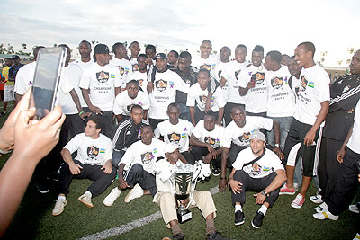 APR players celebrate after winning the Peace Cup last year. The New Times / T. Kisambira.