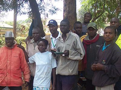 The writer (4th from left) poses for a picture with locals of Kitale.