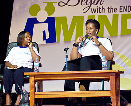 Mrs Kagame adresses the girl students as Monique Nsanzabaganwa,the deputy chair of the Unity Club listens. The New Times/ Timothy Kisambira. 