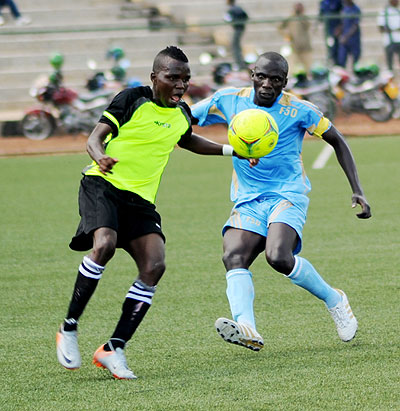 Police Fc skipper Jean Bosco Uwacu (right) battling with LLB Academic striker Gael Duhayindavya during Saturday clash at Stade de Kigali. The New Times / J. Mbanda.