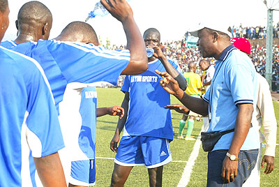 Raoul Shungu (right), seen here giving instruction to Rayon players during a Peace Cup match against Atraco in 2008. He took Rayon to Fifa over unpaid arrears. The New Times / File.