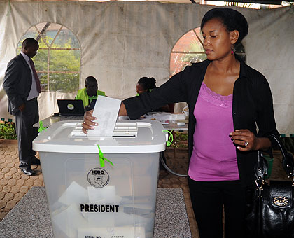 A voter casts her vote at the Kenyan High Commission in Kigali yesterday. Kenyans took to the polls to vote for a new leader to replace outgoing President Mwai Kibaki. By press time,  ....