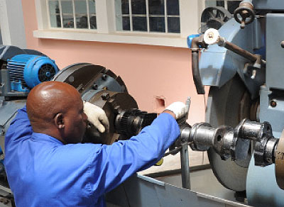 An engineer operates machinery in a factory in Kigali recently. Local engineers can now spread their expertise across the region after a treaty was amended to absorb Rwanda and Burundi....