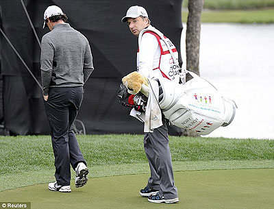 The two-time major champion Rory McIlroy (left) called time on his round after playing only eight holes. Net photo.
