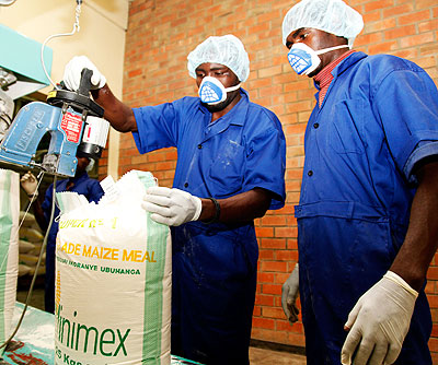 Workers packing maize at Minimex. Agro-processors want to strengthen their presence in Burundi The New Times/Timothy Kisambira.