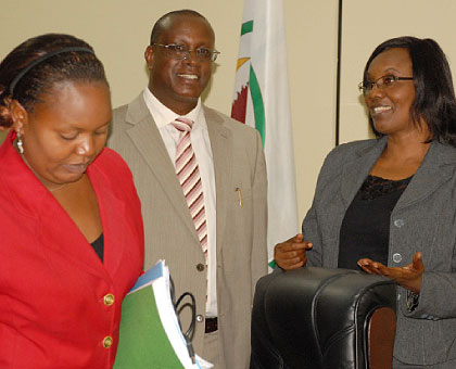 Senator Jean Damascene Bizimana (C) chats with Rose Mukantabana, the Speaker of the lower chamber (R) and MP Jeanne du2019Arc Uwimanimpaye  after releasing the report yesterday. The New ....