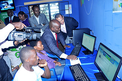 Nsengimana browses websites on one of the donated computers in Nyarurama cell, Kicukiro district, yesterday.  The New Times/ T. Kisambira.