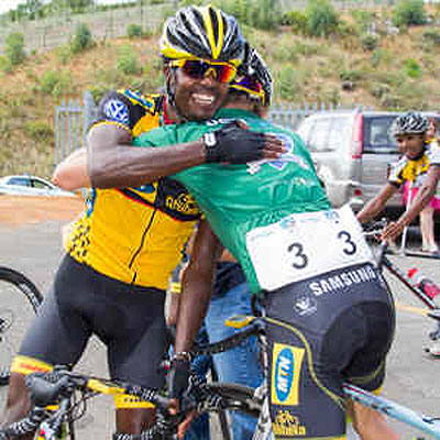 Estifanos Gebresilassie with teamate. Net photo.