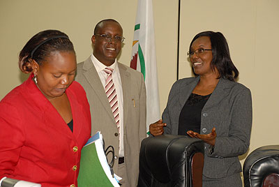 Senator Jean Damascene Bizimana (C) chats with Speaker Rose Mukantabana (R) and MP Jeanne du2019Arc Uwimanimpaye after releasing the report on Wednesday this week. The New Times/Courtesy.