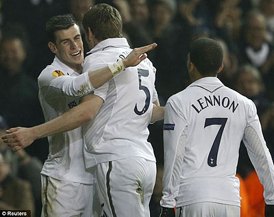 Bale (left) is congratulated by team-mates after another sensational display. Net photo.