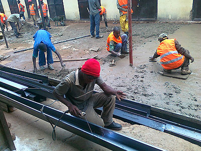 Workers doing repairs at the market yesterday. The works are expected to be completed in April.  The New Times / Peterson Tumwebaze .