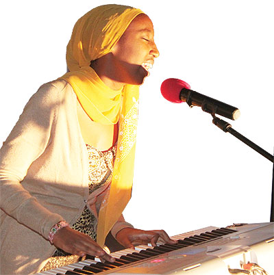 Mali sings at the function.