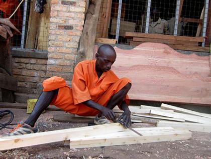 A prisoner at work inside Huye Prison carpentry workshop. The programme plays a great role in rehabilitating prisoners. The New Times/ JP Bucyensenge. 