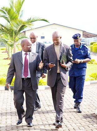Nsengimana (L) chats with Harerimana as the two ministers arrive for the launch of the ICT campaign at Police Headquarters in Kacyiru, yesterday.    The New Times/ Timothy  Kisambira.