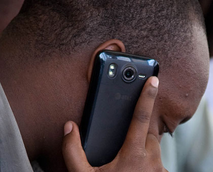 A man makes a call. Airtime is still expensive in EAC. The New Times/ T. Kisambira.