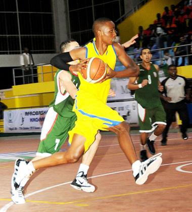 Lionel Hakizimana, seen here in action during a past youth international game against Morocco, will be a key player for Rwanda at the Afro-basket championships.. The New Times / File.