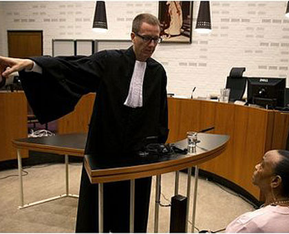 Basebya (sitting) during one of the court sessions in the Netherlands.   Net Photo. 
