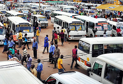Modern buses and decrepit taxis side by side in Nyabugogo bus park. Net photo.