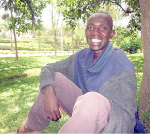 Emmanuel Ndagijimana relaxing and thinking under an avocado tree near Kisementi in Remera. The New Times.  Eugene Kwibuka..