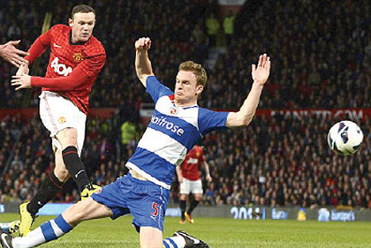 Rooneyu2019s shot took a deflection off Reading defender Alex Pearce before nestling in the net. Net photo.