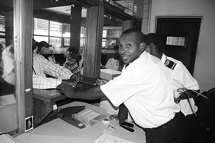Customs workers attend to travellers. The EAC customs union implemented in 2005 has been sucessful.  Experts are urging caution on monetory union.