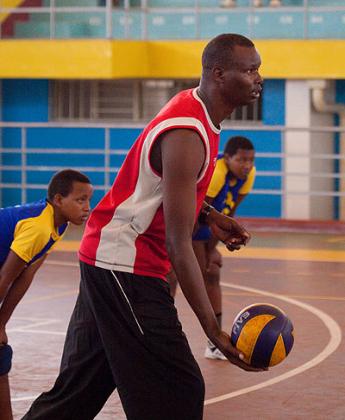 Coach Paul Bitok taking the girls through drills last week at Amahoro indoor stadium. The New Times/J. Mbanda.
