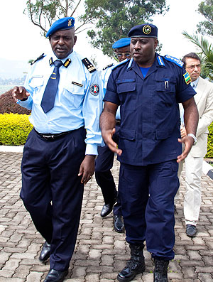 Inspector General of Police Emmanuel K Gasana(R) with his Burundian counter -part Andre Ndayanbaje at police headquarters yesterday. The New Times T.Kisambira-