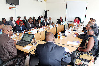 Prof. Mbanda (with laptop) addresses members of the Partiesu2019 Forum during the meeting yesterday. The New Times/ Clement Uwiringiyimana