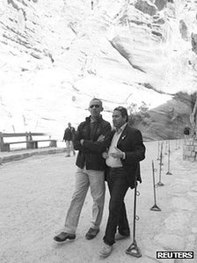 Mr Obama (left) was escorted by tourism professor Suleiman al-Farajat. Net photo