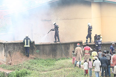 Police fire brigade extinguishing at a factory in Kigali recently. The insurance sector has expanded to take on such incidents. The New Times / Plaisir Muzogeye