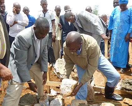 Minister Murekezi (R) and mayor Rwagaju lay a foundation stone to begin construction of the centre. The New Times/ Courtsey Photo. 