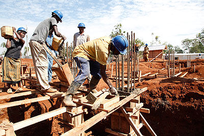 Masons work at a construction site recently. The City of Kigali has changed procedures for construction permit application.    The New Times/ File.