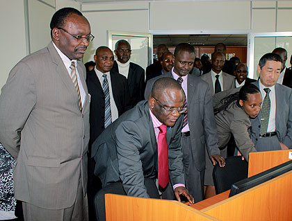 Kanimba (L) and other officials at the launch of TISC in the National Library on Tuesday. The New Times/  John Mbanda.