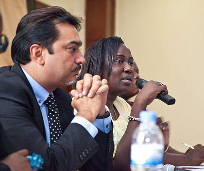 Eriyo (R) addresses the EAC participants at the launch of EAHP as Dr Thakker looks on. The New Times/ Timoty Kisambira.