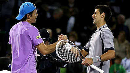Novak Djokovic (R) congratulates Tommy Haas on his win at the Miami Masters. Net photo.