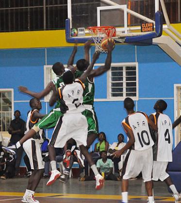 Espoir (green) beat APR (white and black) in Game Three of the playoff final 78-68 at Amahoro indoor stadium to complete a 3-0 whitewash. The New Times / P. Muzogeye.