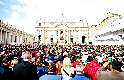  A view of crowds as Pope Francis appears prior to delivering his first u2018Urbi et Orbiu2019 blessing from the balcony of St. Peteru2019s Basilica during Easter Mass yesterday in Vatican C....