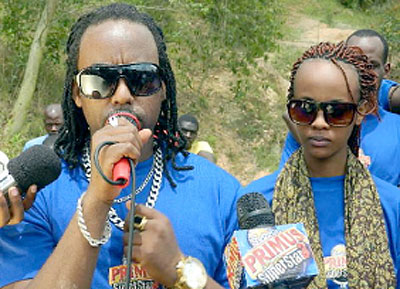 Urban Boyz frontman, Humble Jizzo speaks to Karuvusha residents after the community work. Looking on is Knowless (R). Courtesy photo.m