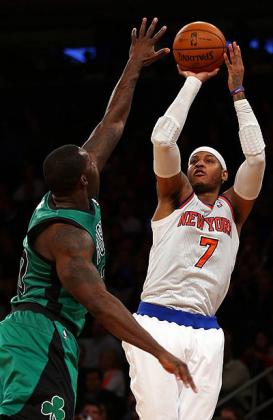 Carmelo Anthony #7 of the New York Knicks takes a shot as Jeff Green #8 of the Boston Celtics defends. Net photo.