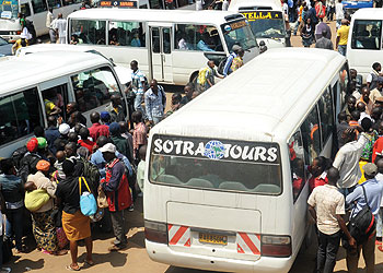 Travellers line up to board a bus. The transport sector is one of those identified by the Rwanda Development Board as requiring more investment. The New Times/File