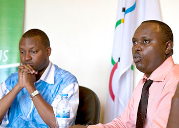 Rwanda Olympic Committee Secretary General Parfait Busabizwa (L) and Philbert Rutagengwa (R), head of the election commission in a news conference held yesterday at the committeeu2019s h....