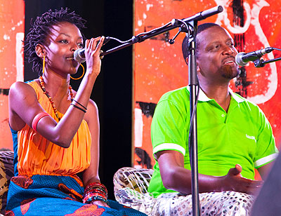 The founder of Gakondo group, Intore Massamba (R) performs with Diana Teta in a tribute concert to remember the countryu2019s fallen musician, Athanase Sentore.